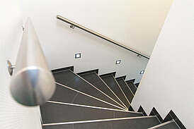 Haus Urmmel Innenansicht Treppe mit Beleuchtung